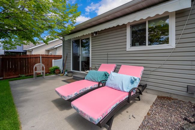 Back Patio area with a built in retractable awning for shade | Image 7