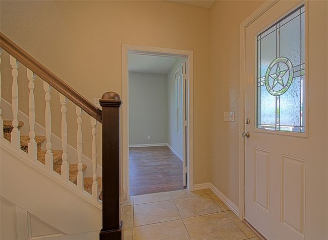 Foyer featuring baseboards, stairs, and light tile patterned floors | Image 10
