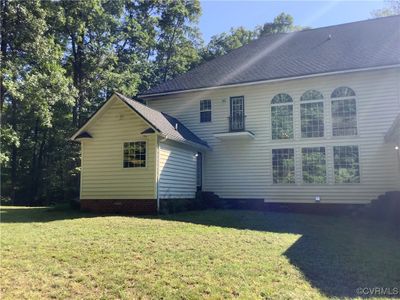 Rear view of house with a lawn | Image 2