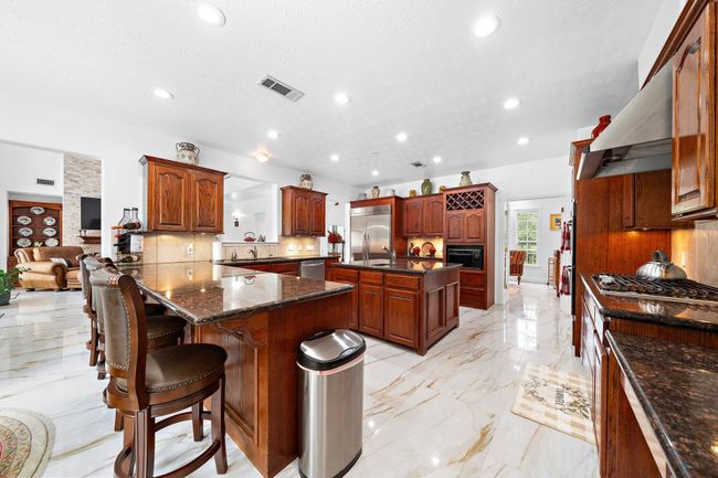 Spacious kitchen with an island and modern appliances | Image 8