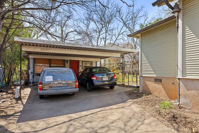 View of parking with driveway and fence | Image 28
