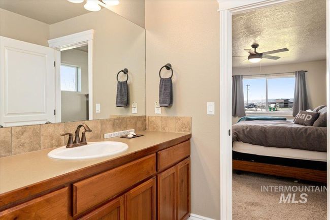 Ensuite bathroom with vanity and ceiling fan | Image 15