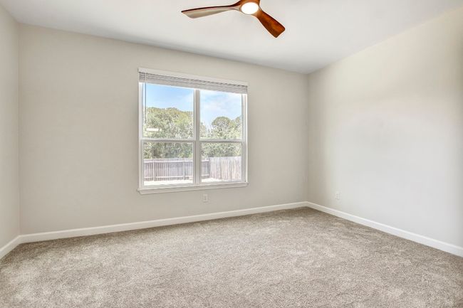 Bedroom 4 with ceiling fan and natural light | Image 19
