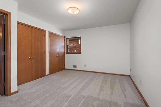Primary Bedroom has his & hers closets, walk though full bathroom and new carpet! | Image 24