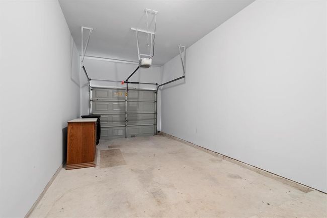The unit has it's own private drive and oversized one car garage. You can drive right in for direct access into your home. | Image 24