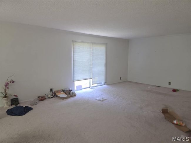 Spare room featuring carpet flooring and ornamental molding | Image 7