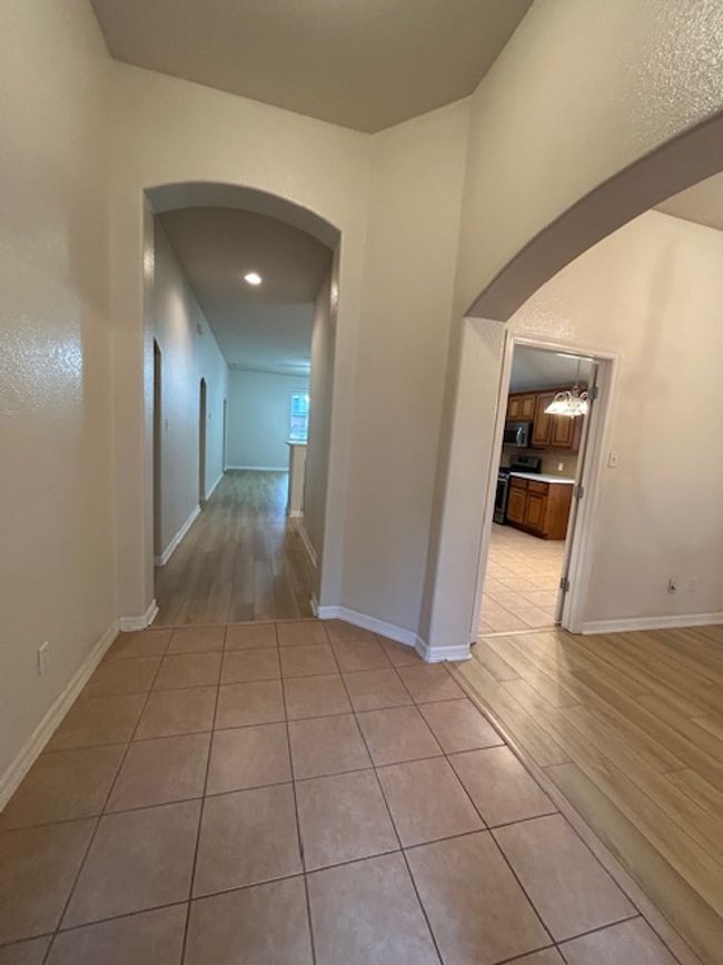 Unfurnished room with light wood finished floors and baseboards | Image 19