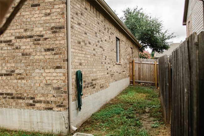 View of home's exterior featuring brick siding | Image 33