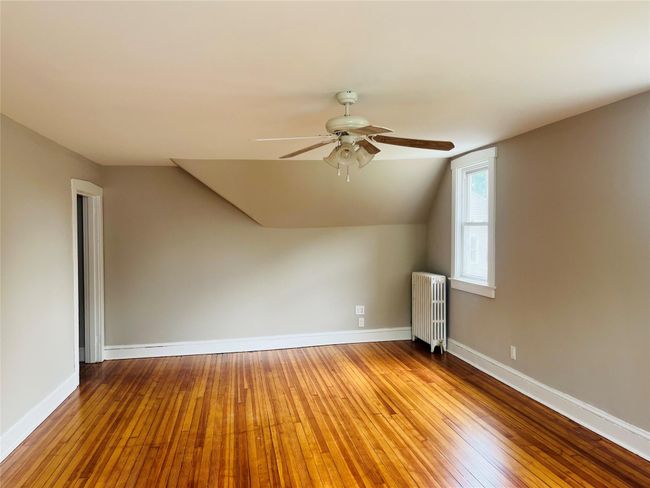 Large living room with ceiling fan, hardwood floors, and and lots of light. | Image 8