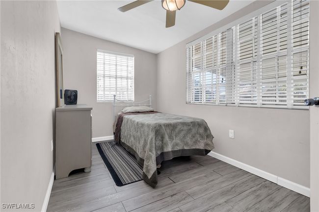 Bedroom featuring baseboards, , and ceiling fan | Image 13