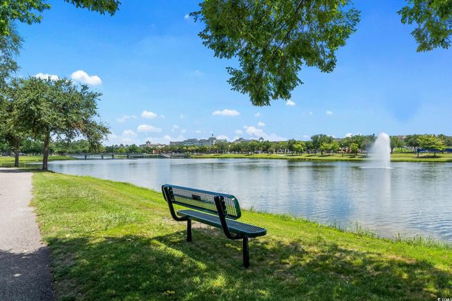 View of home's community featuring a lawn and a water view | Image 34