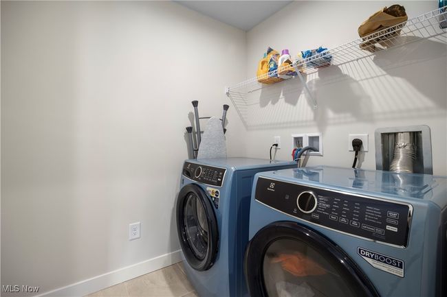 Laundry room with laundry area, baseboards, and washing machine and dryer | Image 22