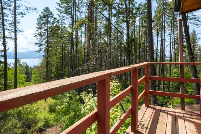 Wooden terrace featuring a wooded view | Image 71