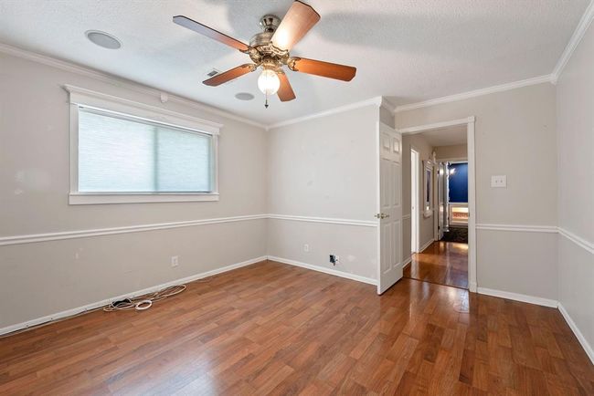 The wood floors continue throughout the bedrooms. | Image 26
