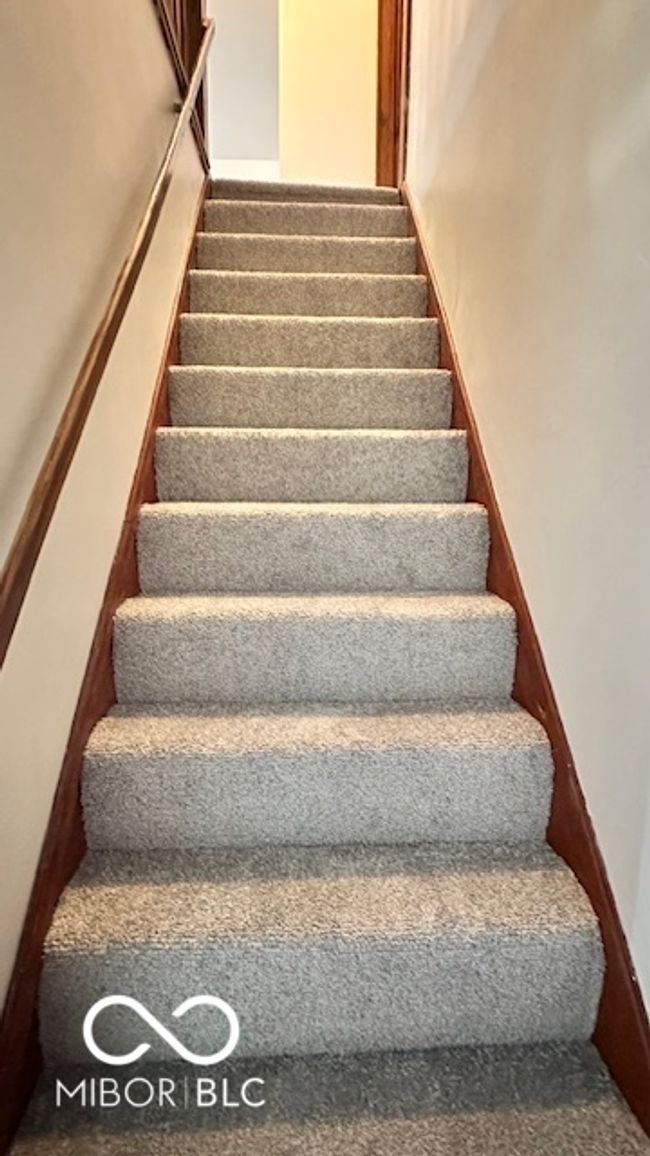 stairs with carpet floors | Image 11