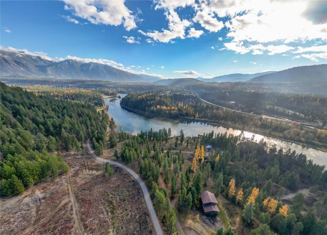 Bird's eye view with a water and mountain view | Image 7