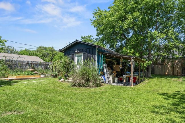 Back of property featuring an outbuilding and a vegetable garden | Image 30