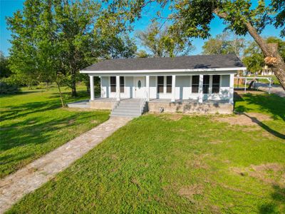 View of front of house featuring a front yard and a porch | Image 1