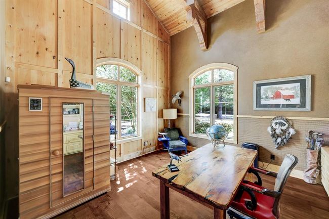 The study has exceptionally high ceilings, built in shelving, and faux finishing. Sauna is excluded. | Image 10