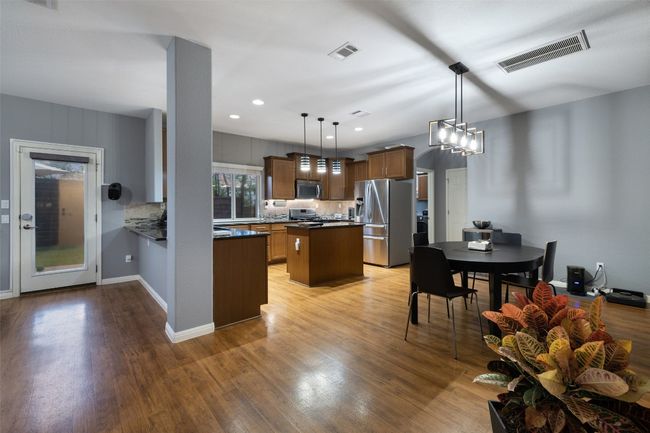 Great floor plan with open kitchen, dining and living on first floor. | Image 8