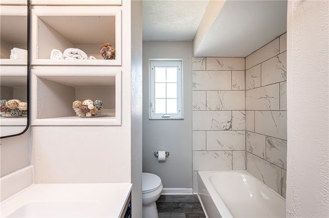 A great ceramic tub surround and full bath. | Image 19