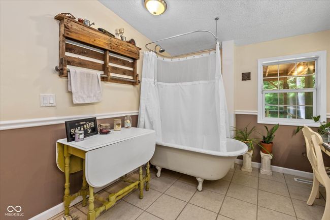 This charming clawfoot tub was added to this home and offers an amazing piece of the past, with all the modern day comforts. | Image 23