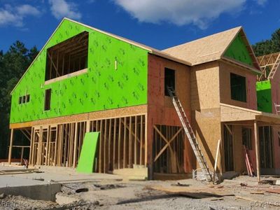 Actual home under construction as of 10/08/2024. The Ivey offers 5 bedrooms, 3.5 baths, and a garage. Durable EVP flooring throughout the first floor main living areas. Architectural details including wainscoting and crown molding give the space a polished look. | Image 3