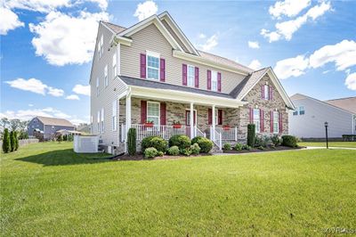 View of front of home featuring a porch and a front lawn | Image 2