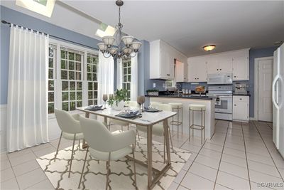 Virtually Staged Kitchen with Eat-in Area & Skylights | Image 2