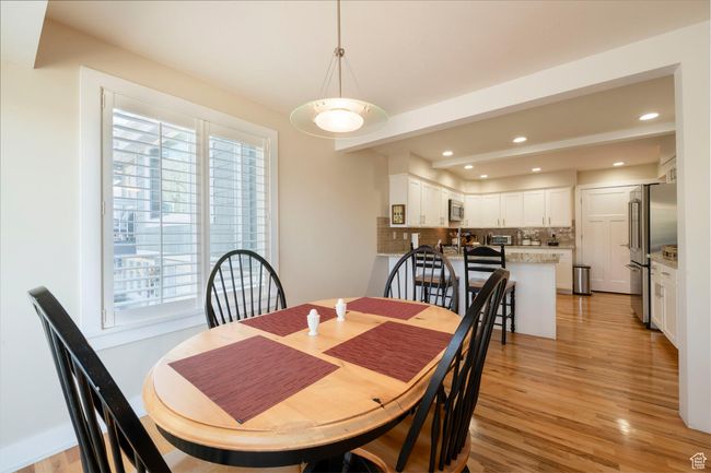 Dining area with recessed lighting and light wood-style floors | Image 24