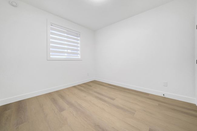 Empty room featuring baseboards and wood finished floors | Image 26