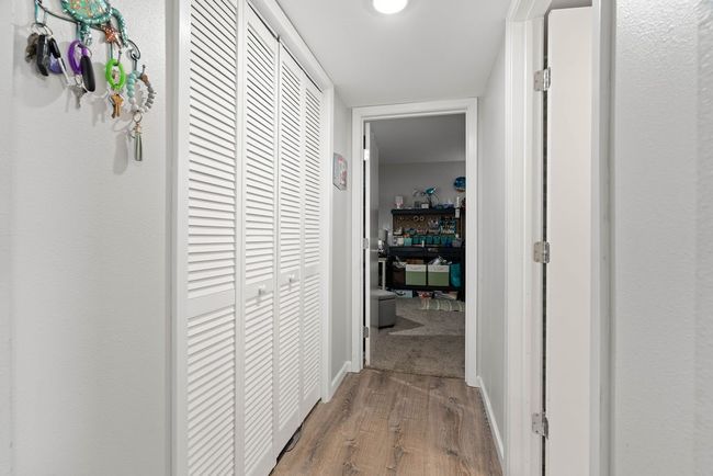 Hallway to 2nd bath with HUGE closet to left | Image 15