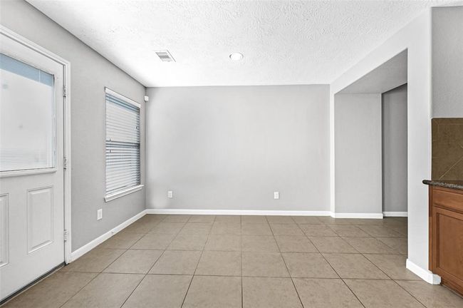 Breakfast room near kitchen. | Image 7