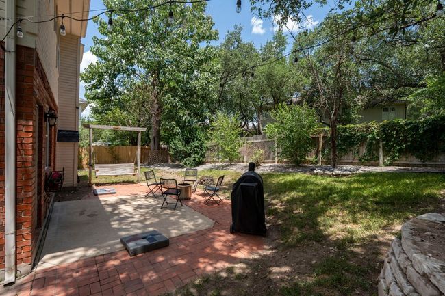 Spacious backyard shaded by beautiful mature trees | Image 22