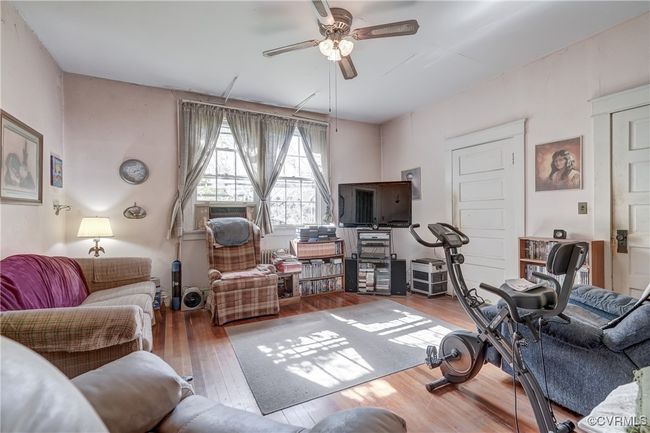 Living area featuring wood-type flooring and ceiling fan | Image 16