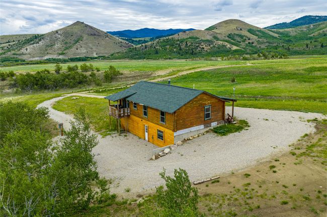 View of mountain backdrop with rural landscape | Image 31