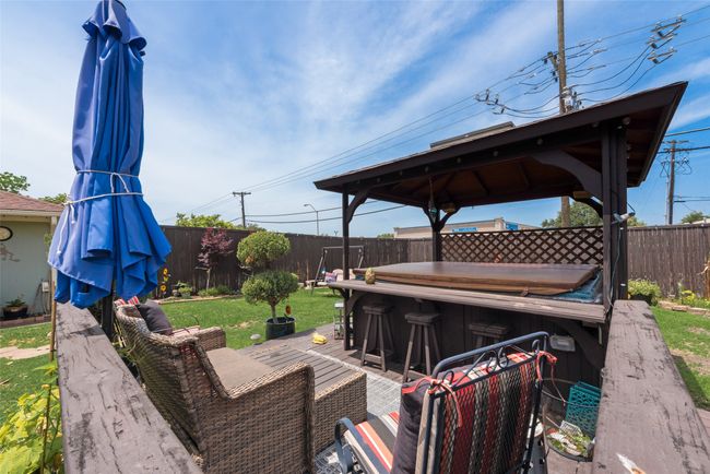 Wooden deck featuring a gazebo | Image 34