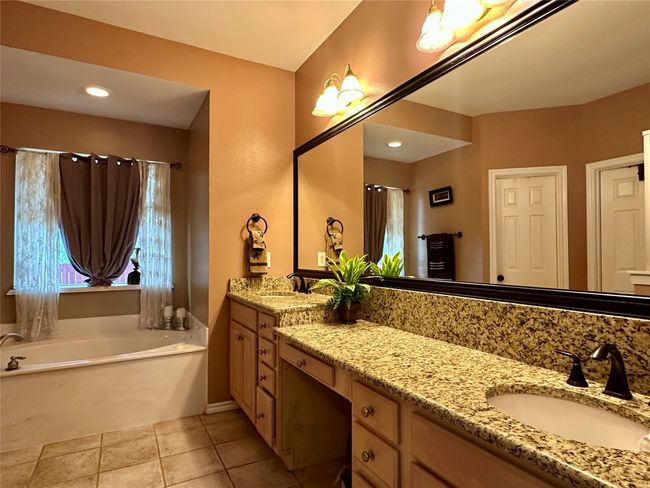 Full bathroom with a garden tub, tile patterned flooring, and vanity | Image 16