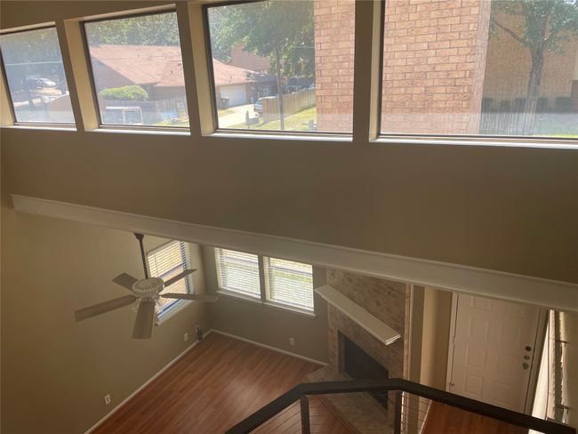 Stairway featuring ceiling fan, a healthy amount of sunlight, and hardwood / wood-style flooring | Image 12