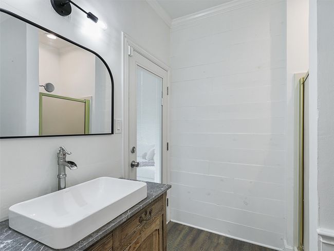 Bathroom with wood finished floors, crown molding, and vanity | Image 20