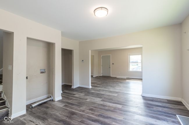 spare room featuring baseboards, visible vents, and wood finished floors | Image 22