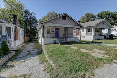 Bungalow-style house featuring covered porch and a front yard | Image 3