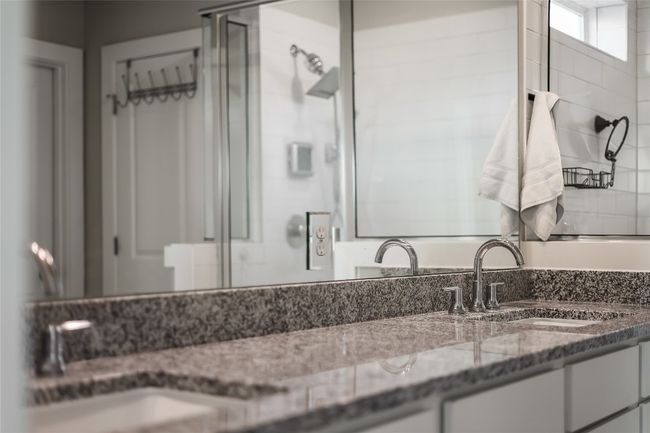 Full bath featuring a shower stall and vanity | Image 23