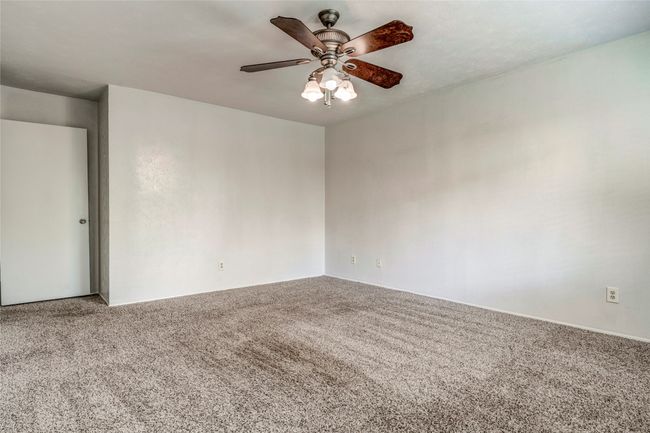 Unfurnished room featuring carpet floors and ceiling fan | Image 23