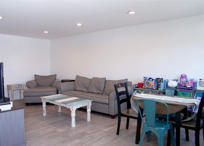 Living room featuring light hardwood / wood-style floors | Image 4
