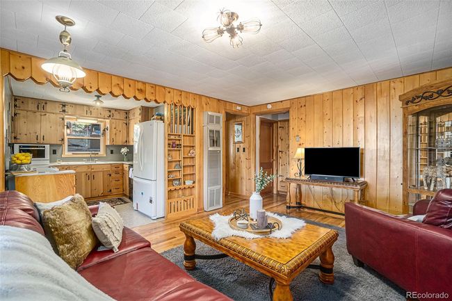 Living room and kitchen are bright and welcoming! | Image 9