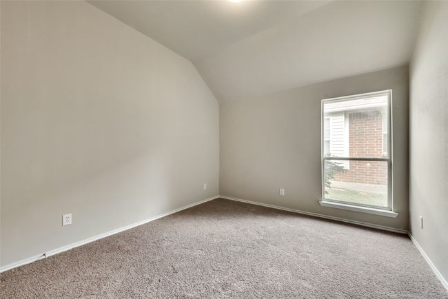 Additional living space featuring carpet floors and lofted ceiling | Image 25