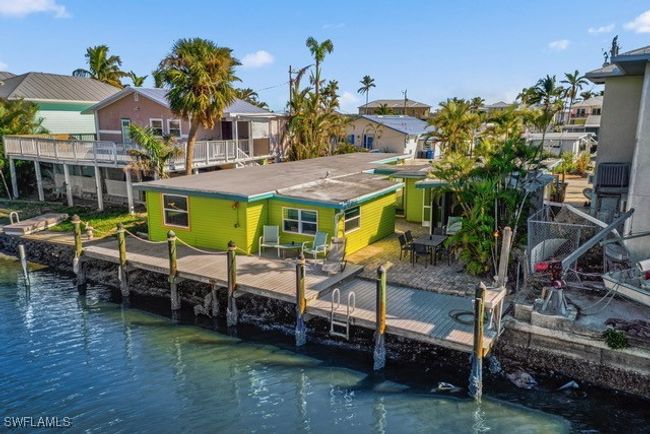 Dock area featuring a water view and a residential view | Image 46