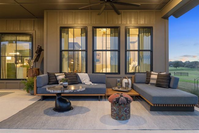 This staged photo of the rear patio offers insight into what a relaxing evening on the porch would feel like. | Image 33