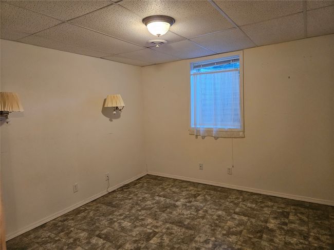 The basement bedroom has egress windows. | Image 24